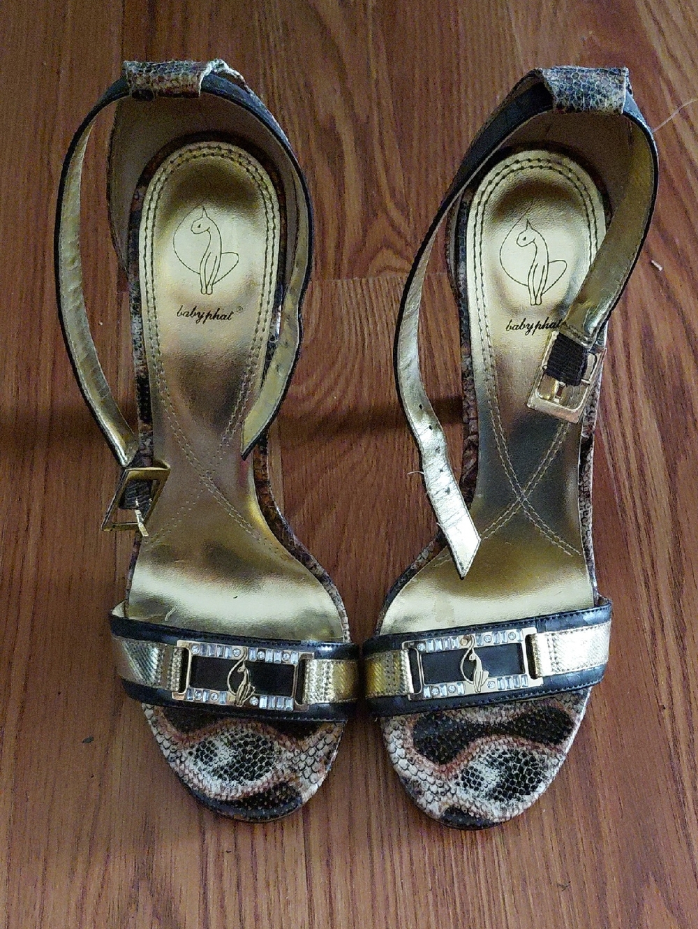 Baby Phat Gold and Snakeskin Ankle-Strap Heels with Logo Accent